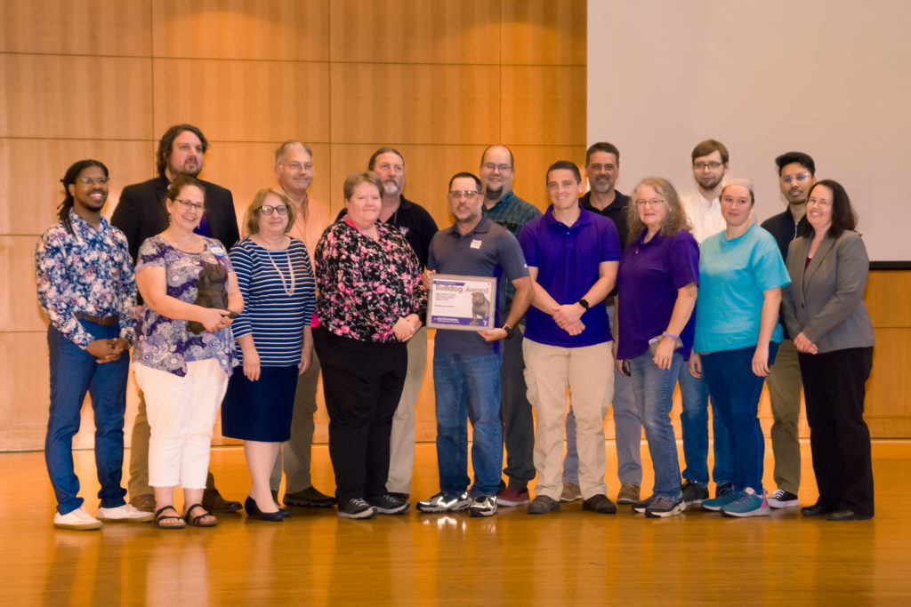 The Information Technology Services Department accepts the Bulldog Award.