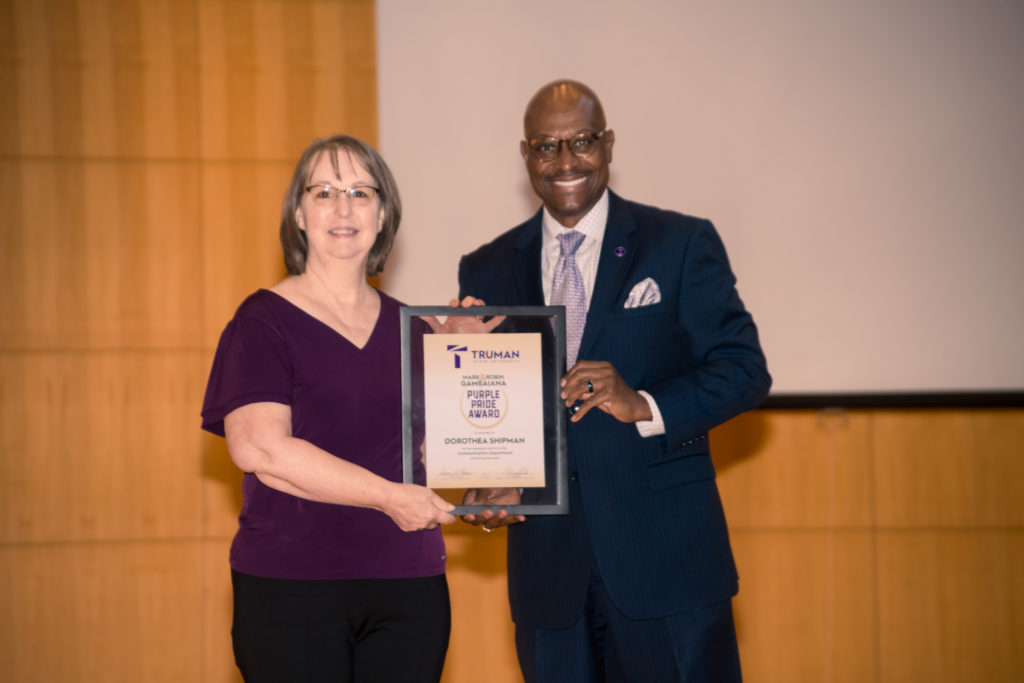 Dorthea Shipman accepts the Purple Pride Award.