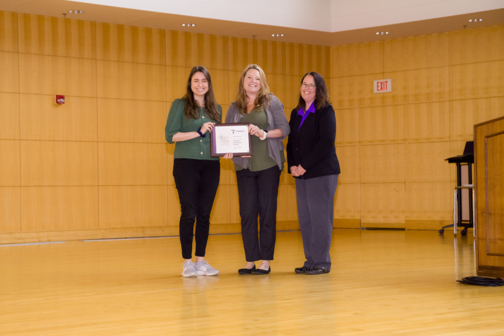 Julie Komar accepts the Points of Excellence Award.