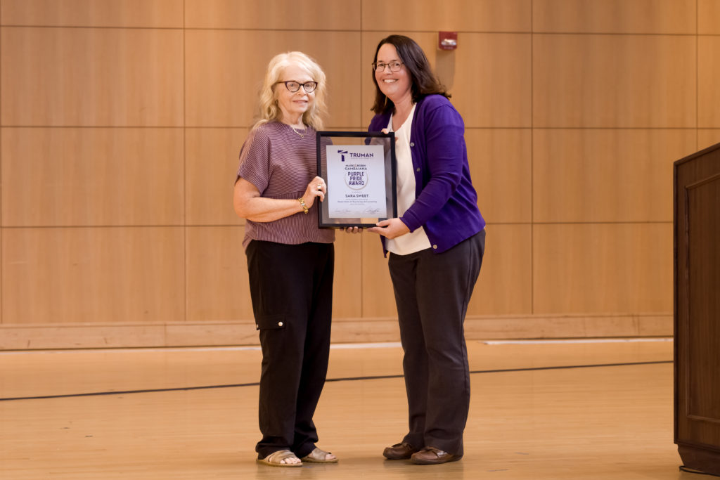 Sara Sweet accepting Purple Pride Award